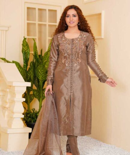 3-piece Hand-worked Copper Raw Silk Dress with a unique divided Hem. Comes with a Soft Organza Dupatta and Matching Trousers.
