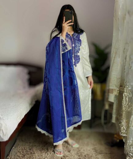 3-piece White and Blue Lawn Dress with a blue Broshia Dupatta and matching white lawn trousers.