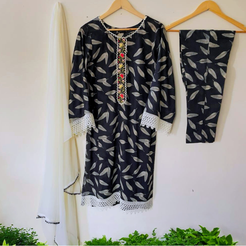 3-piece Black Printed Lawn Dress with a soft black laced chiffon dupatta and matching lawn trousers.