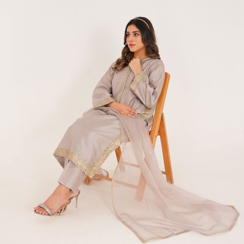 3-piece Silver Raw Silk Dress with Organza Dupatta and matching Raw Silk Trousers.